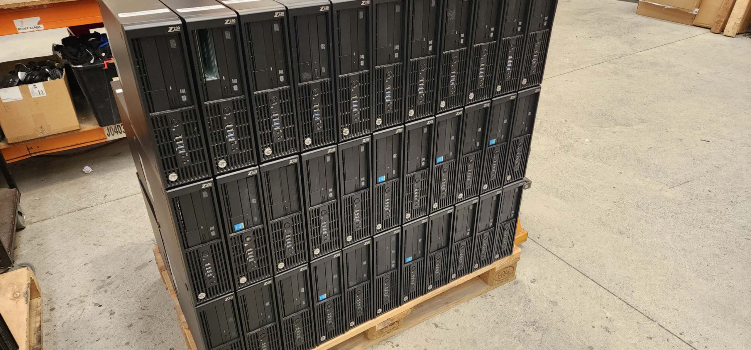 A pallet of HP business desktop computers in the WEI warehouse